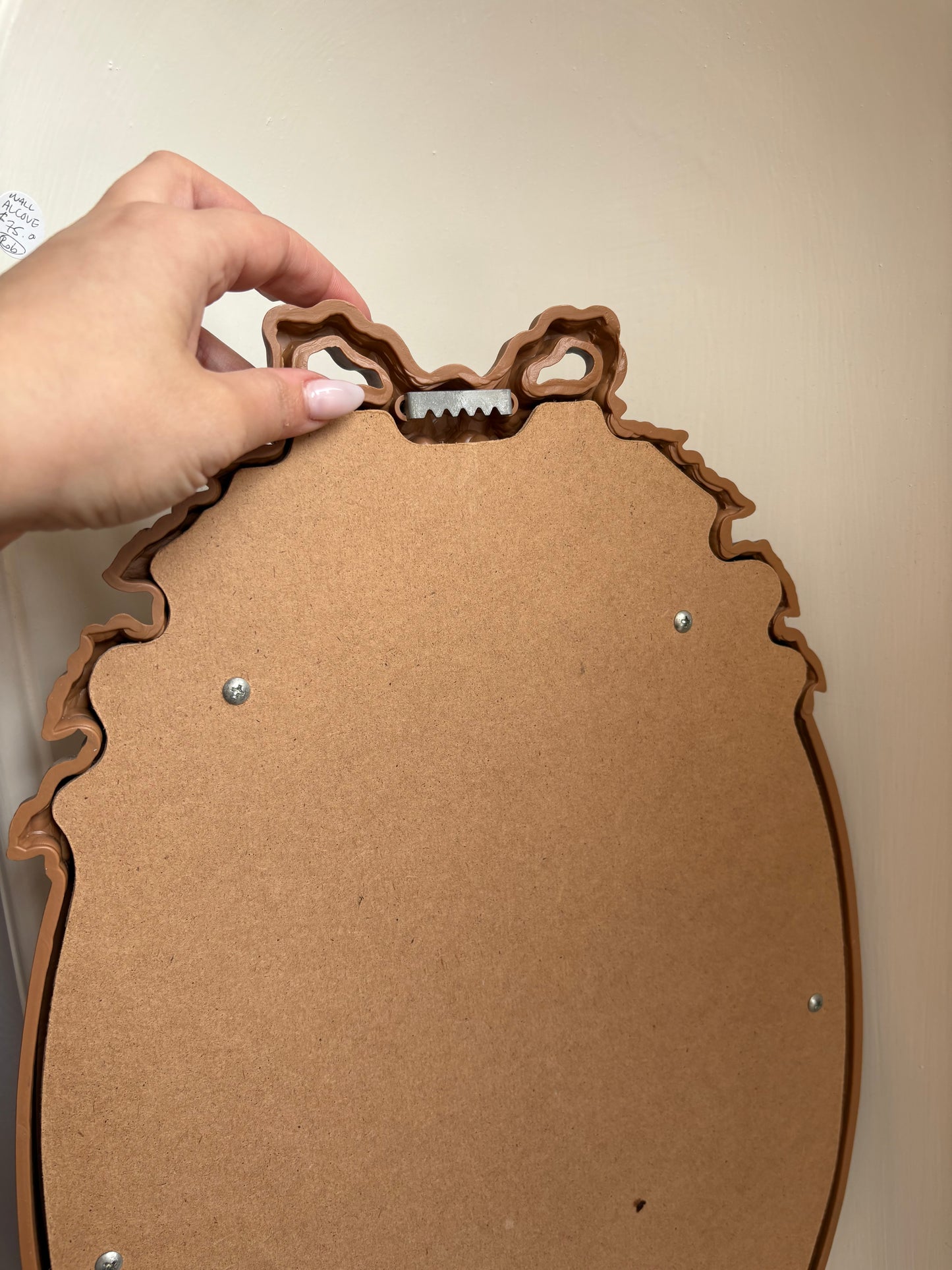 1970s Gold Oval Mirror with with bow detail - plastic frame