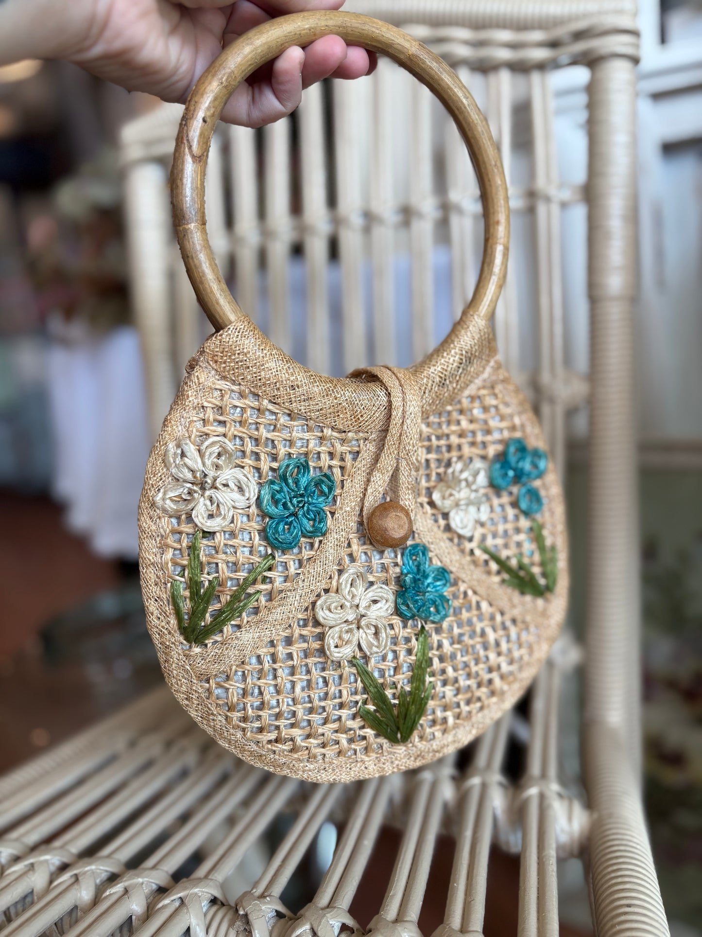 Small woven handbag with bamboo handles