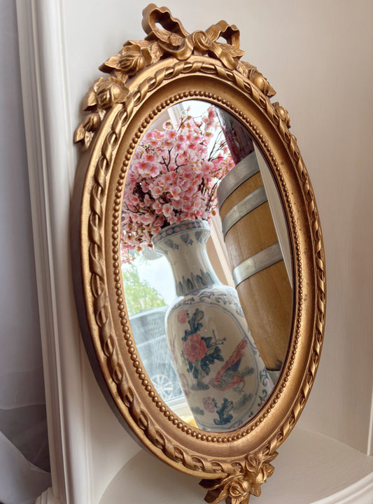 1970s Gold Oval Mirror with with bow detail - plastic frame
