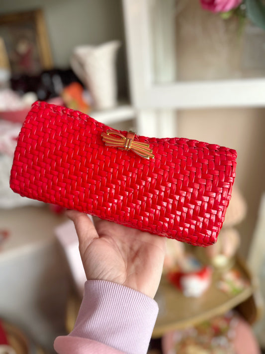 Red weaved purse with gold bow detail