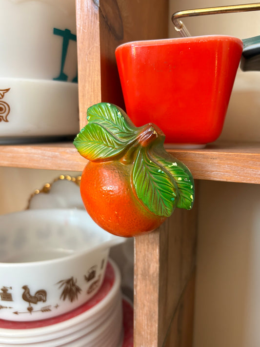 Chalkware hanging oranges
