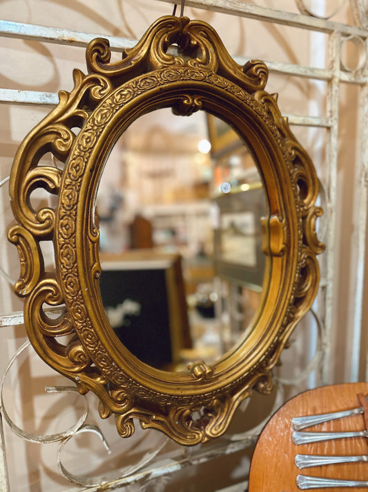 Gold ceramic framed mirror