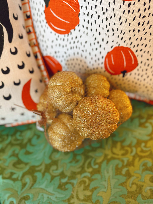 Bag of small glittered gold pumpkin decorations (approx 8 inside)