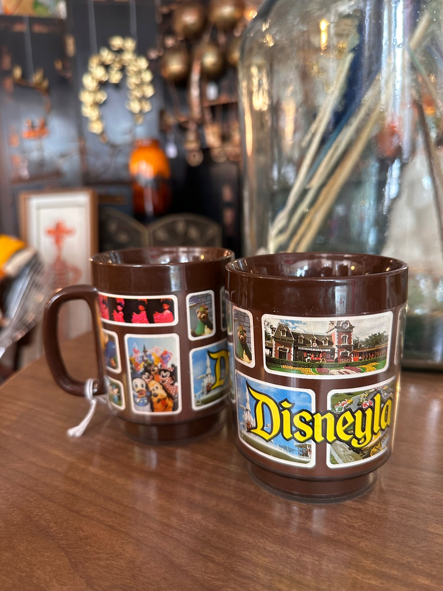Set of 2 1970s Disneyland Plastic Mugs with images from the park