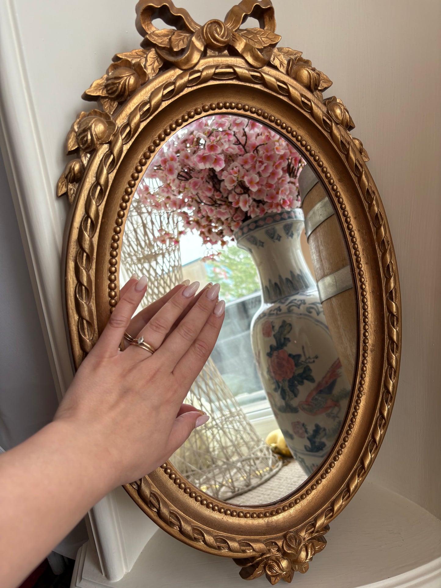1970s Gold Oval Mirror with with bow detail - plastic frame