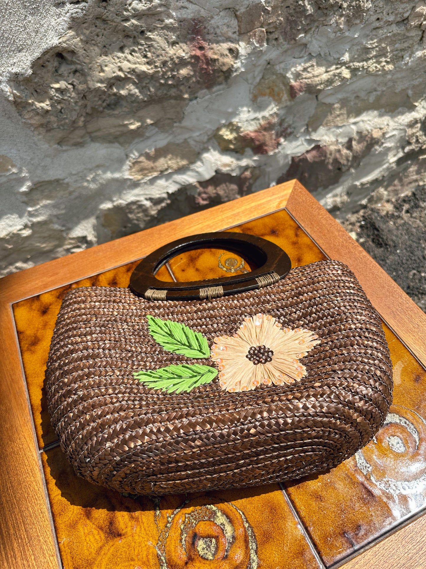 Woven handbag with flower detail