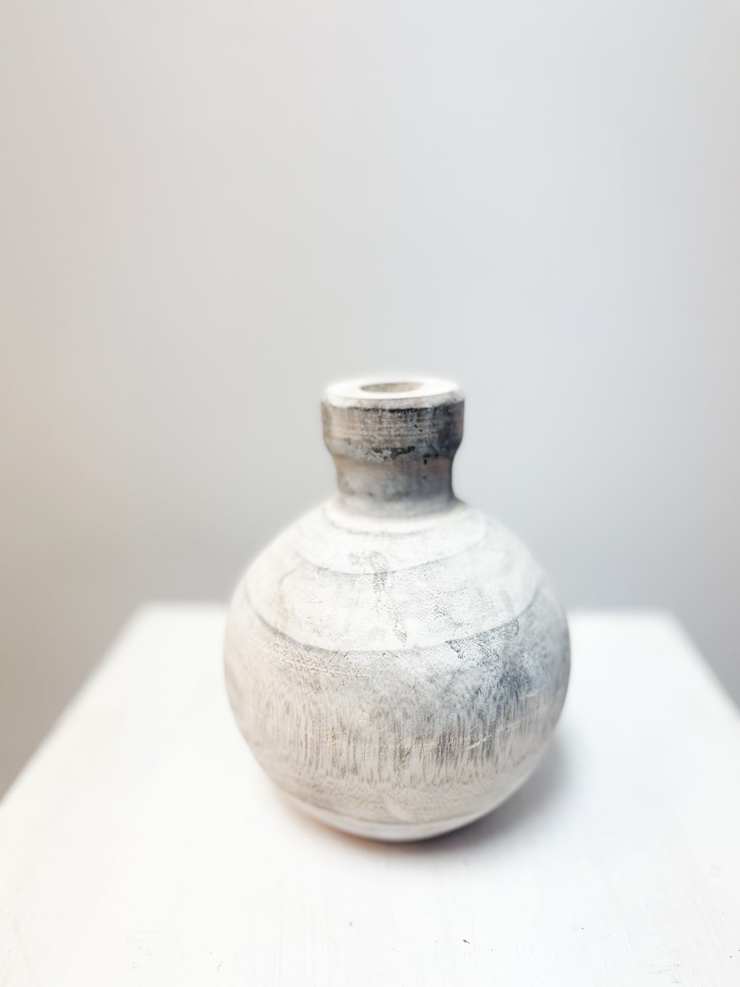 Small round wooden vase