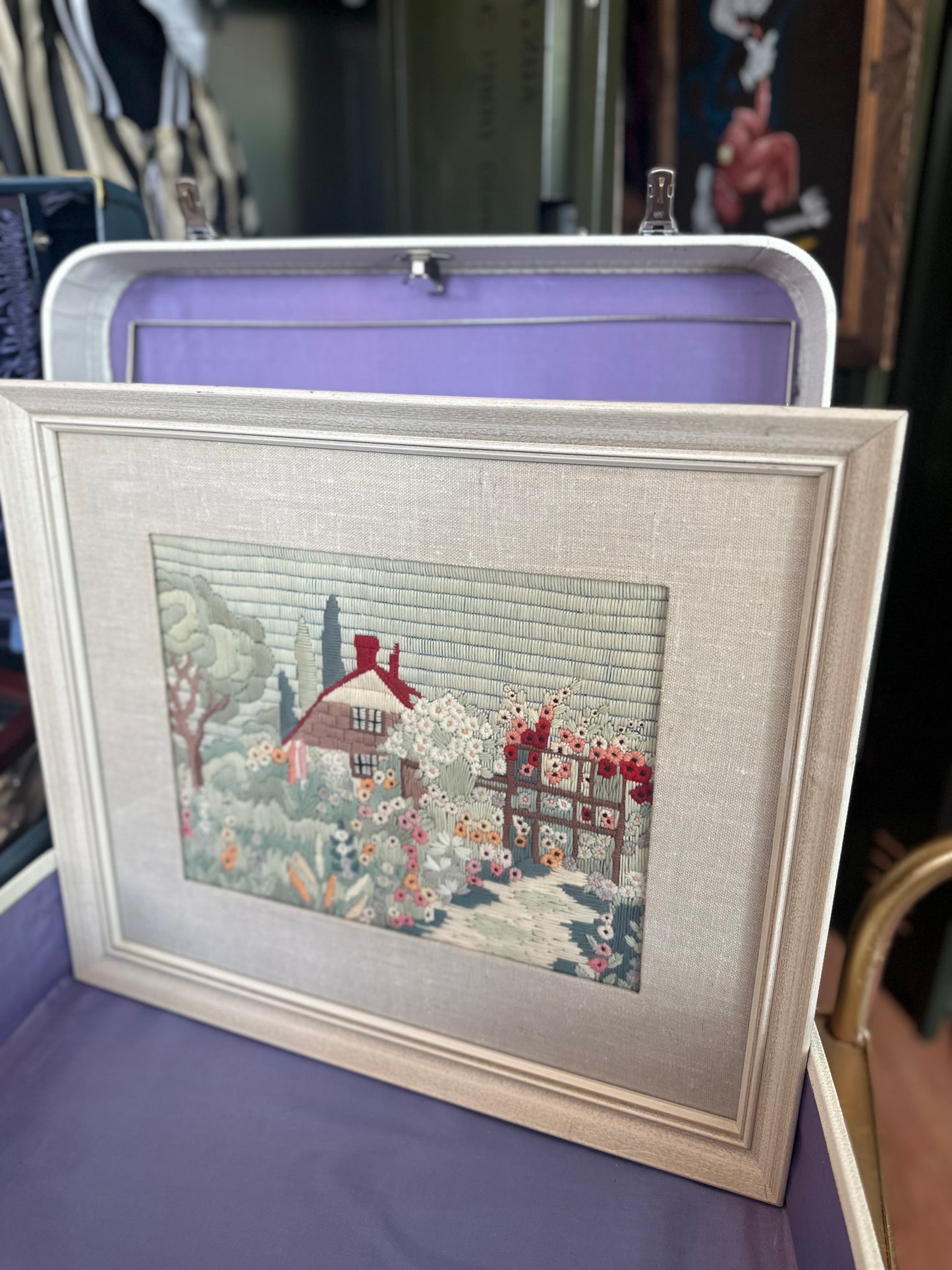 Framed embroidery picture of a garden