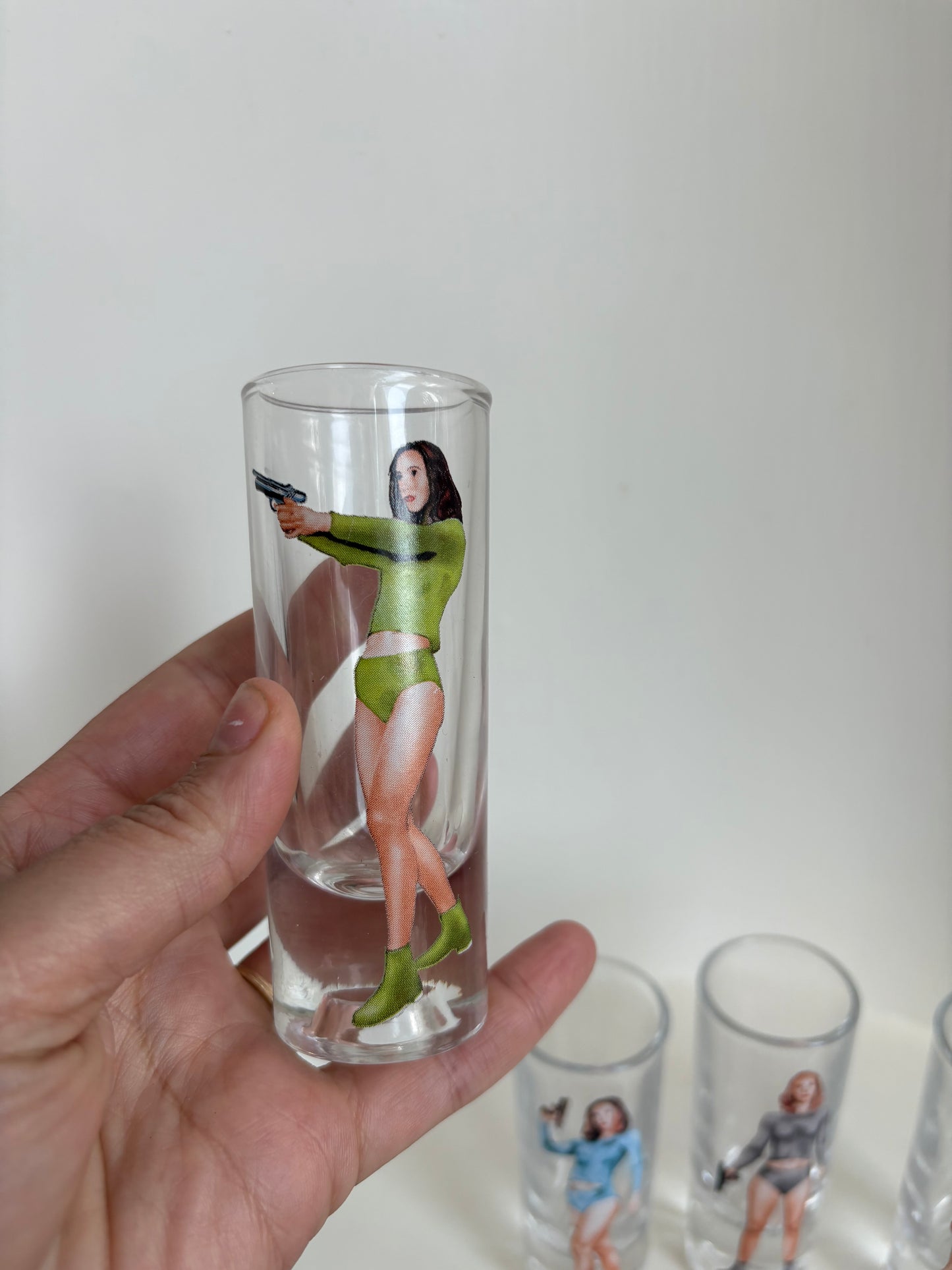 Set of 4 shooter shot women retro shot glasses - sci fi Bond girl 70s