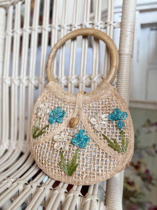 Small woven handbag with bamboo handles