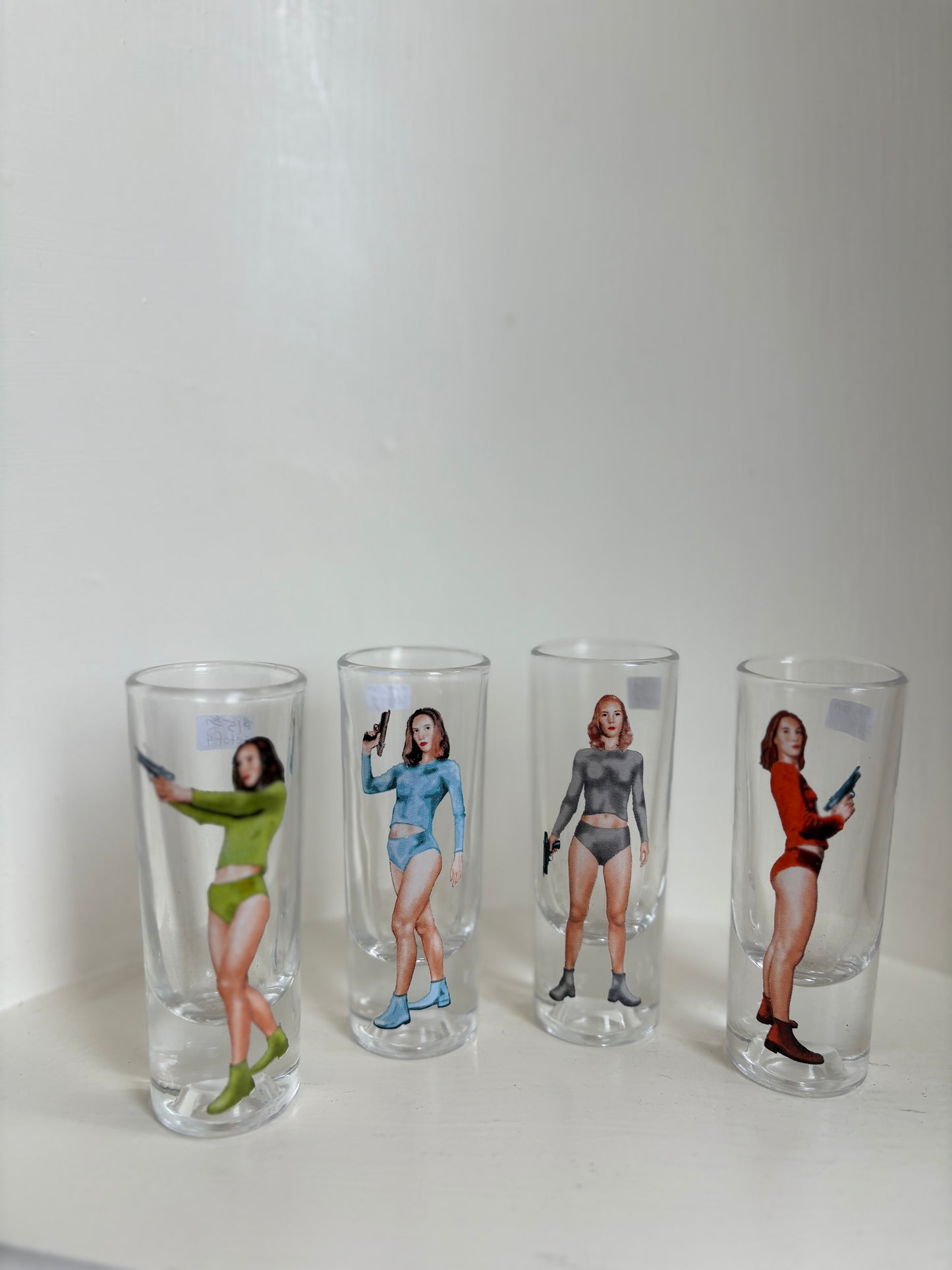 Set of 4 shooter shot women retro shot glasses - sci fi Bond girl 70s