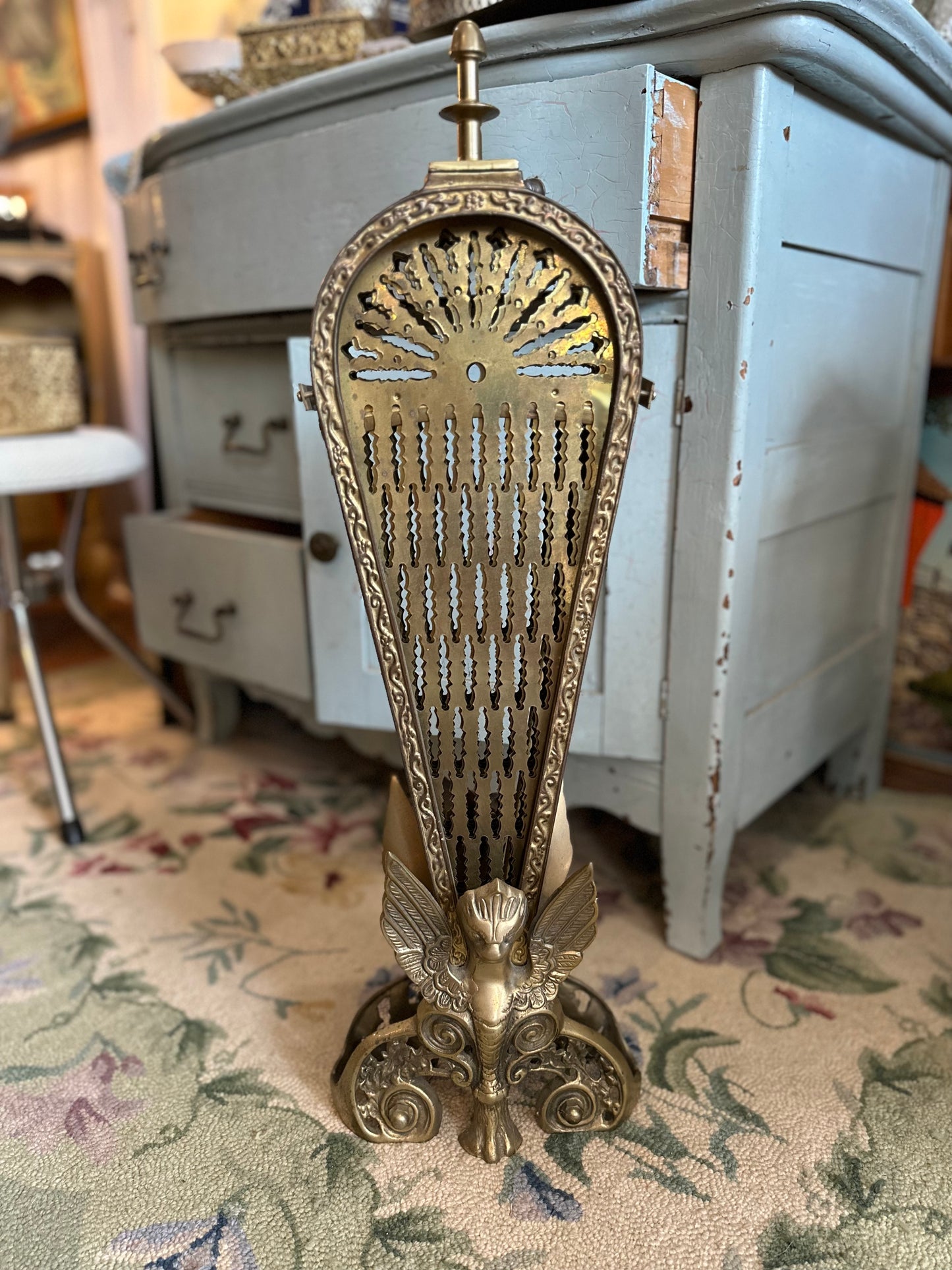 Brass fireplace fan screen with winged Gargoyle