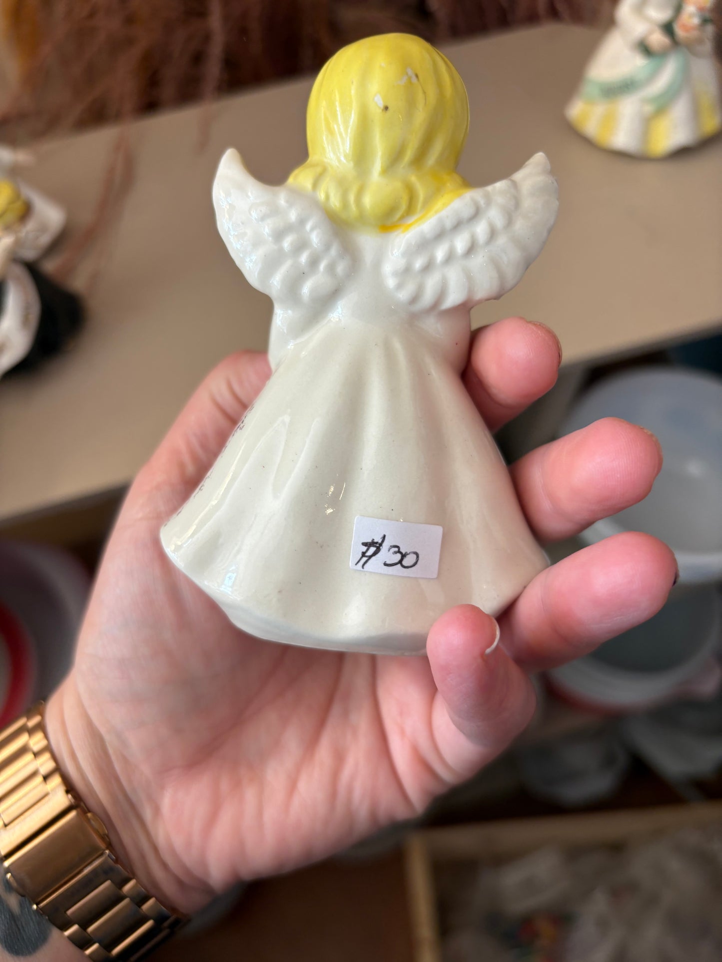 August Angel Figure holding pink flower