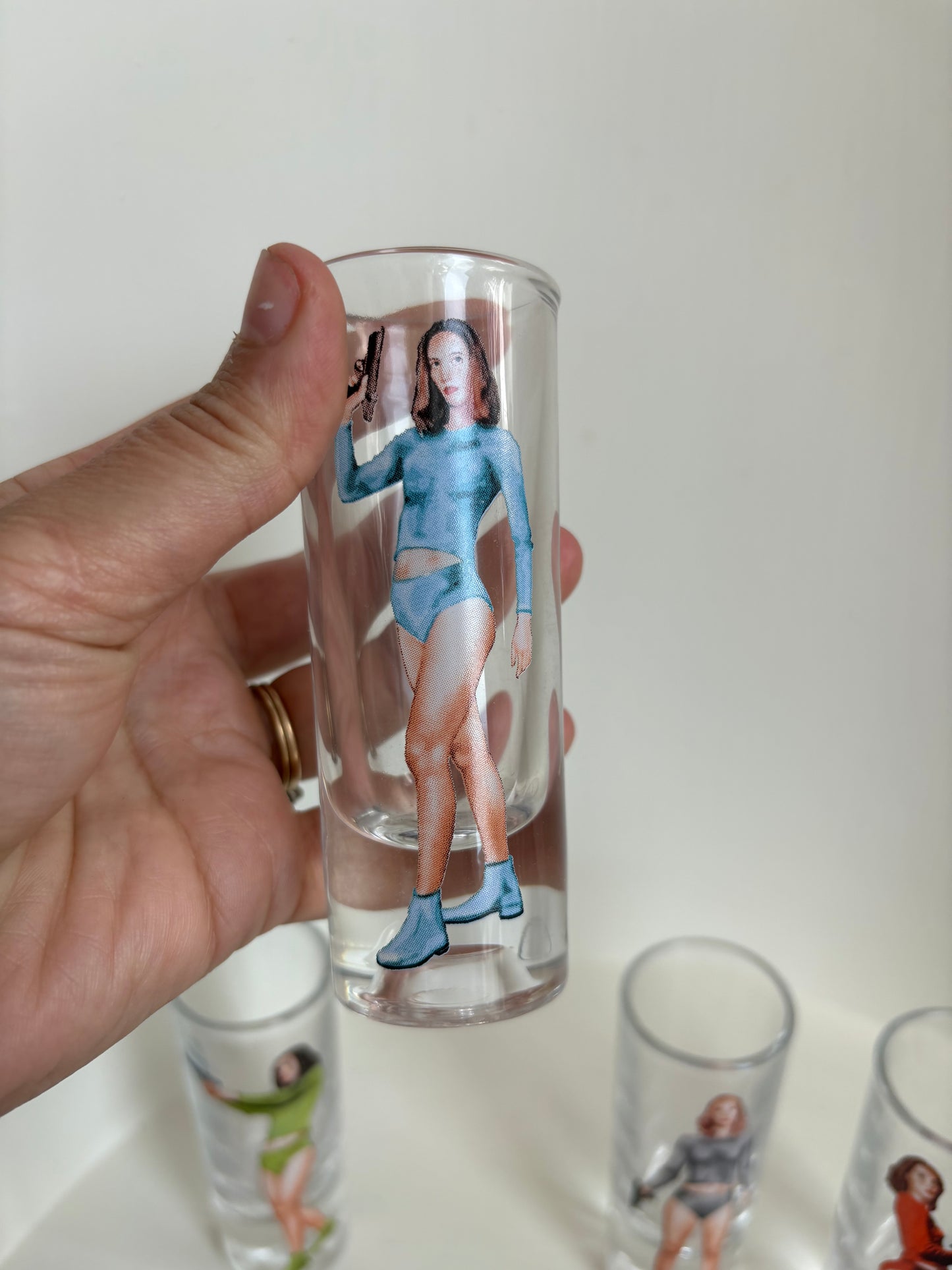 Set of 4 shooter shot women retro shot glasses - sci fi Bond girl 70s