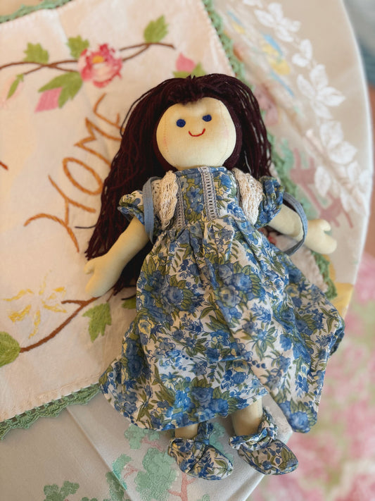 Brunette Doll with vintage Cornelloki Clothing