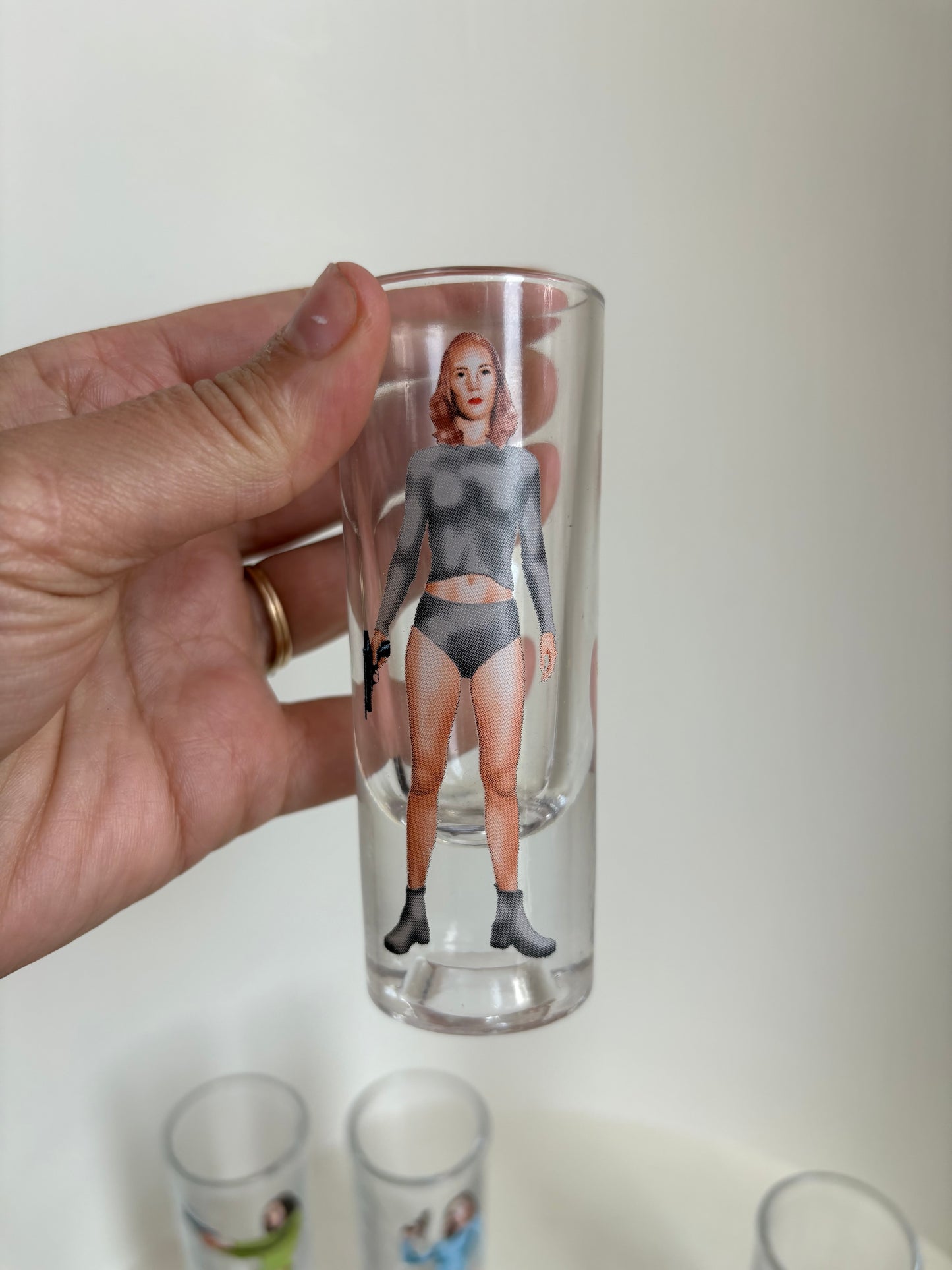 Set of 4 shooter shot women retro shot glasses - sci fi Bond girl 70s