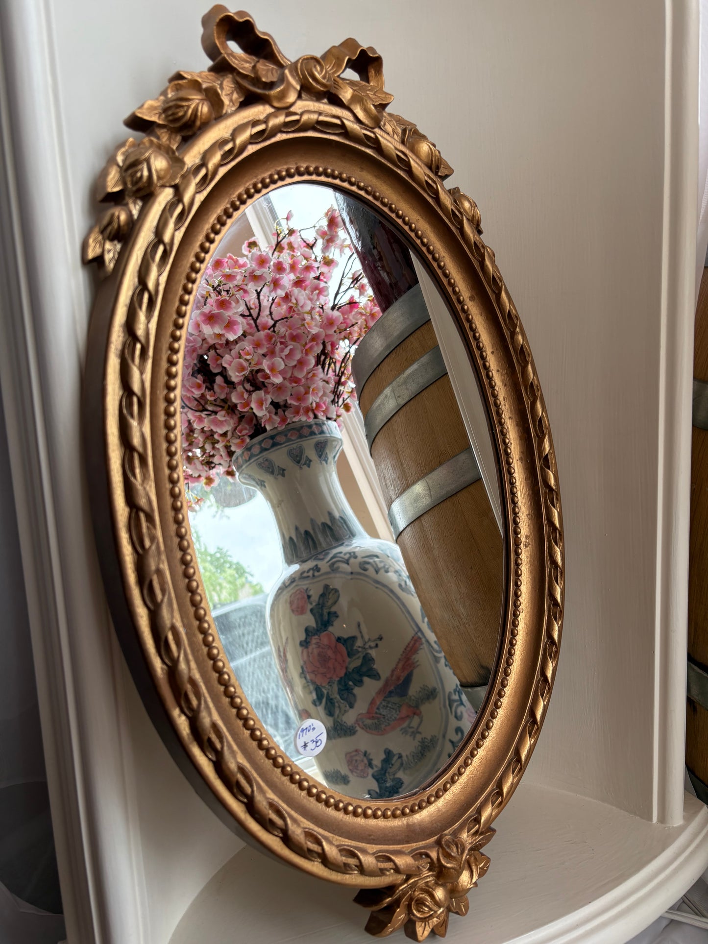 1970s Gold Oval Mirror with with bow detail - plastic frame
