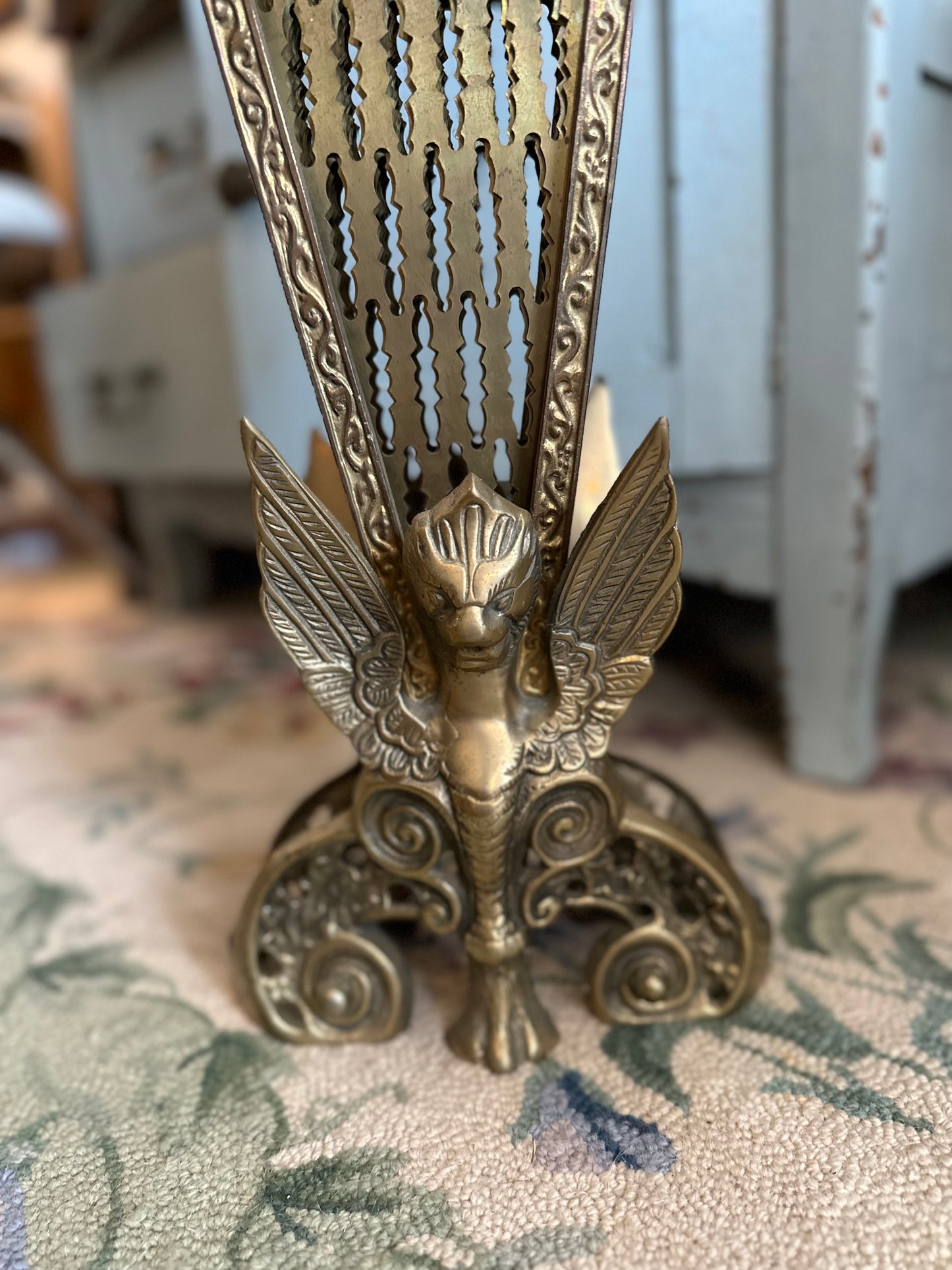 Brass fireplace fan screen with winged Gargoyle