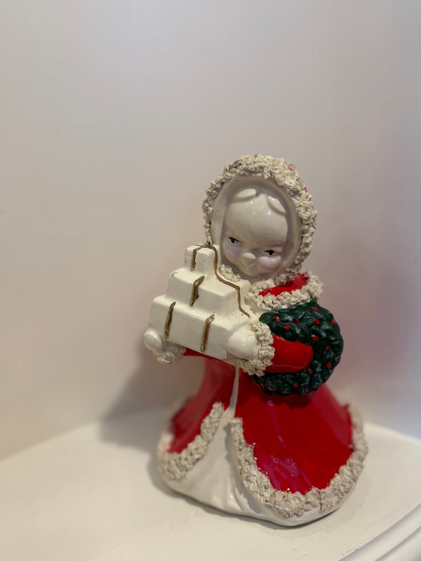 Christmas Shopping girl planter  with presents and wreath