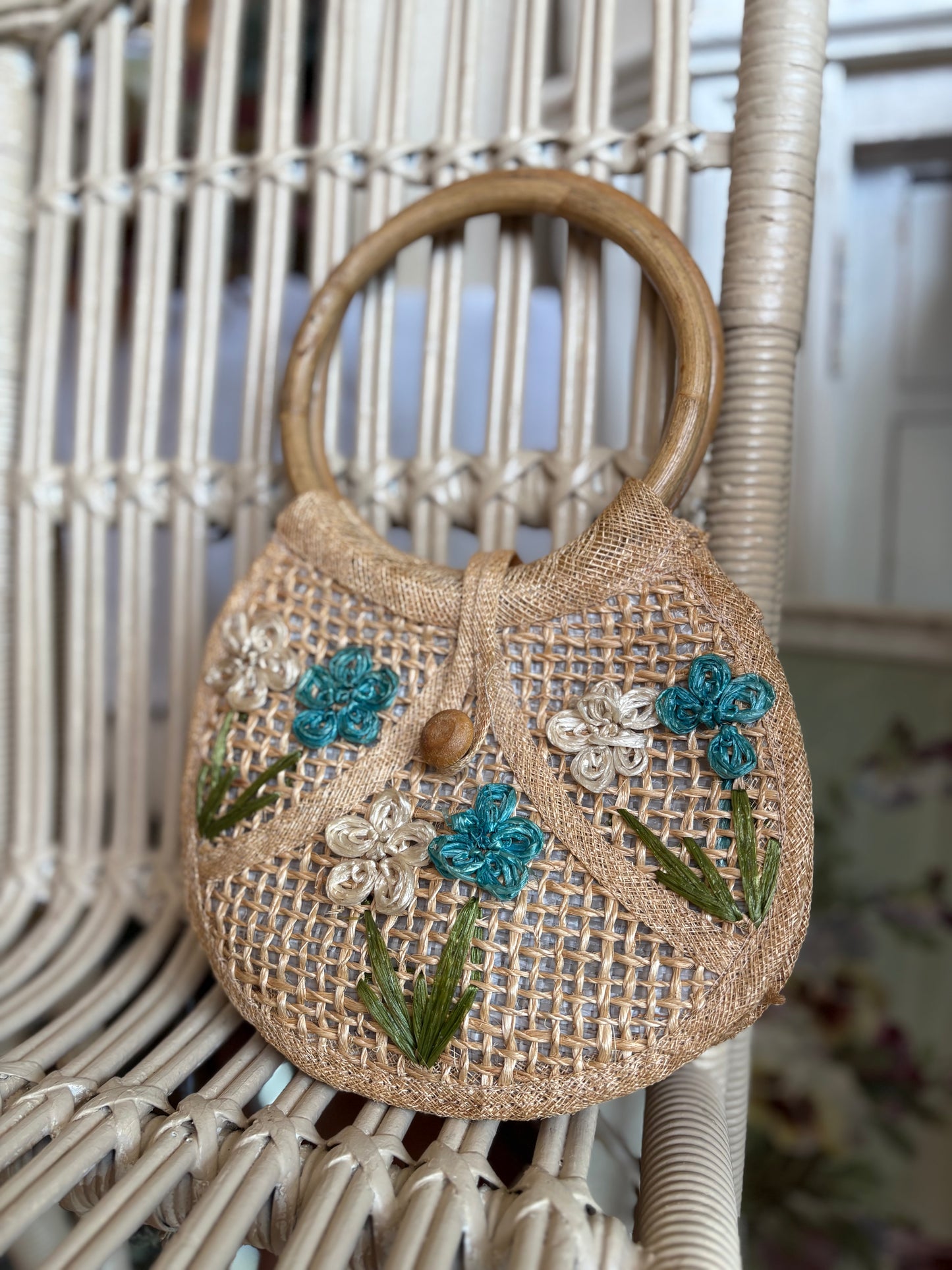 Small woven handbag with bamboo handles