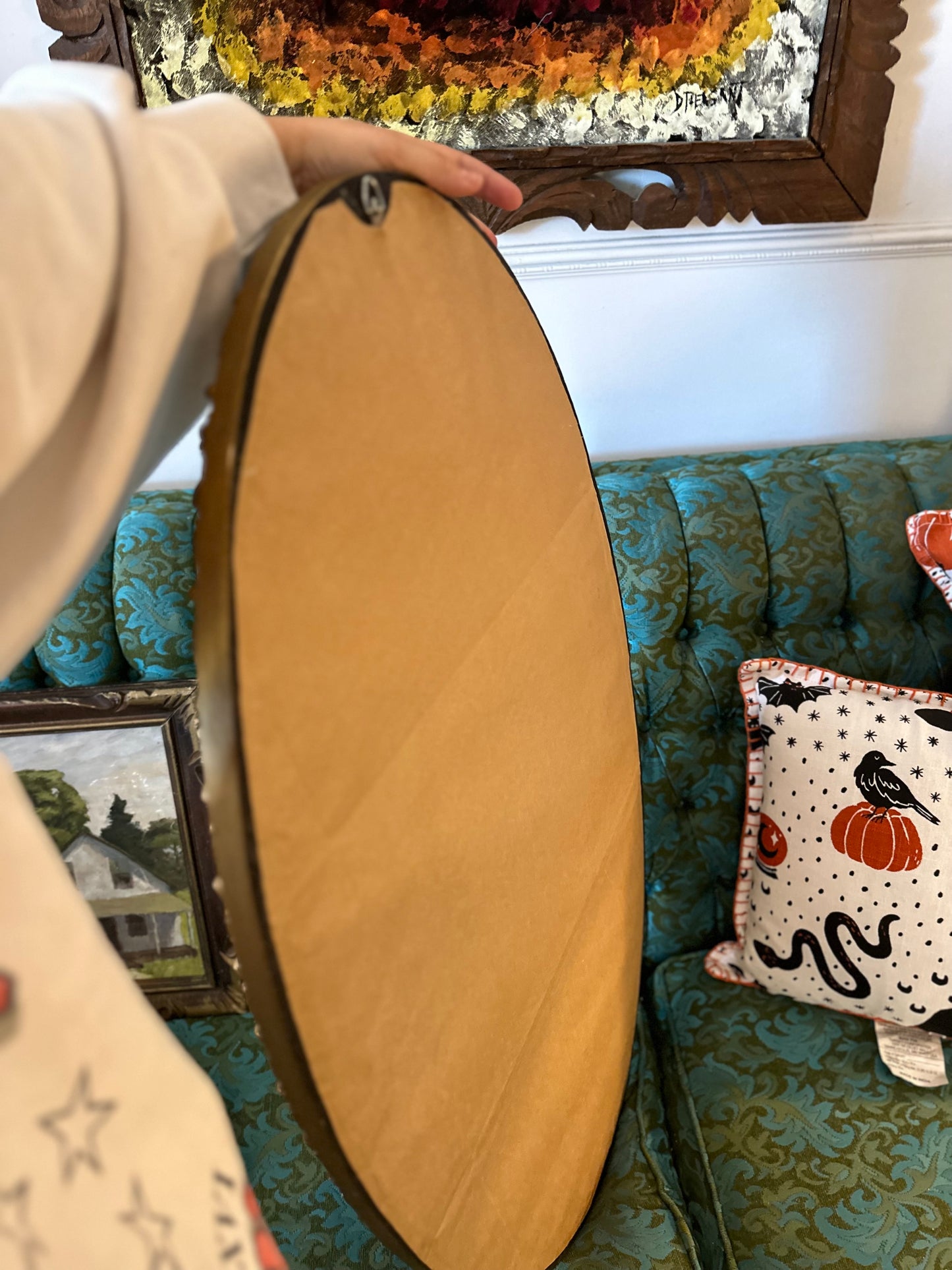 Oval mirror with intricate gold frame