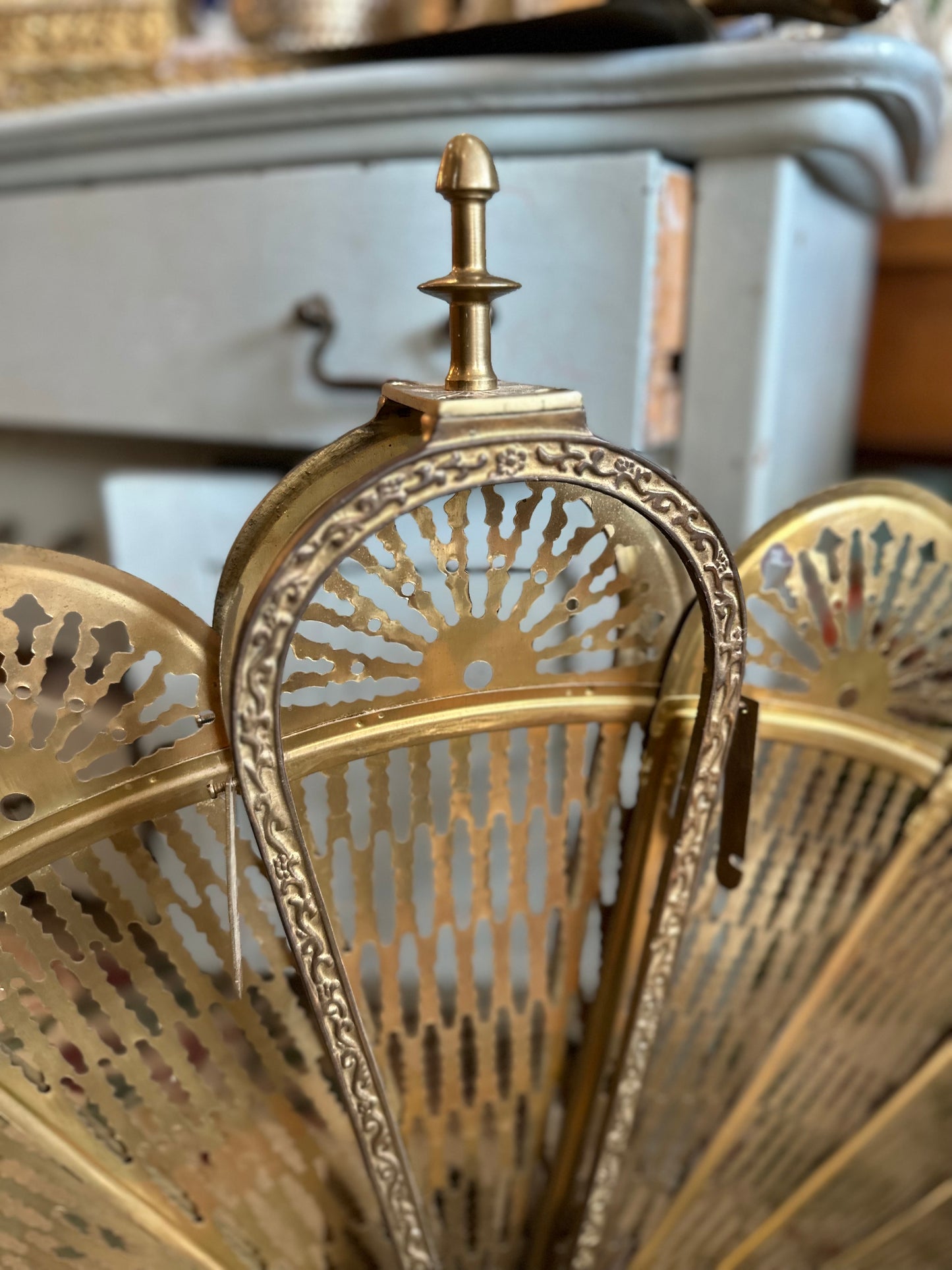 Brass fireplace fan screen with winged Gargoyle