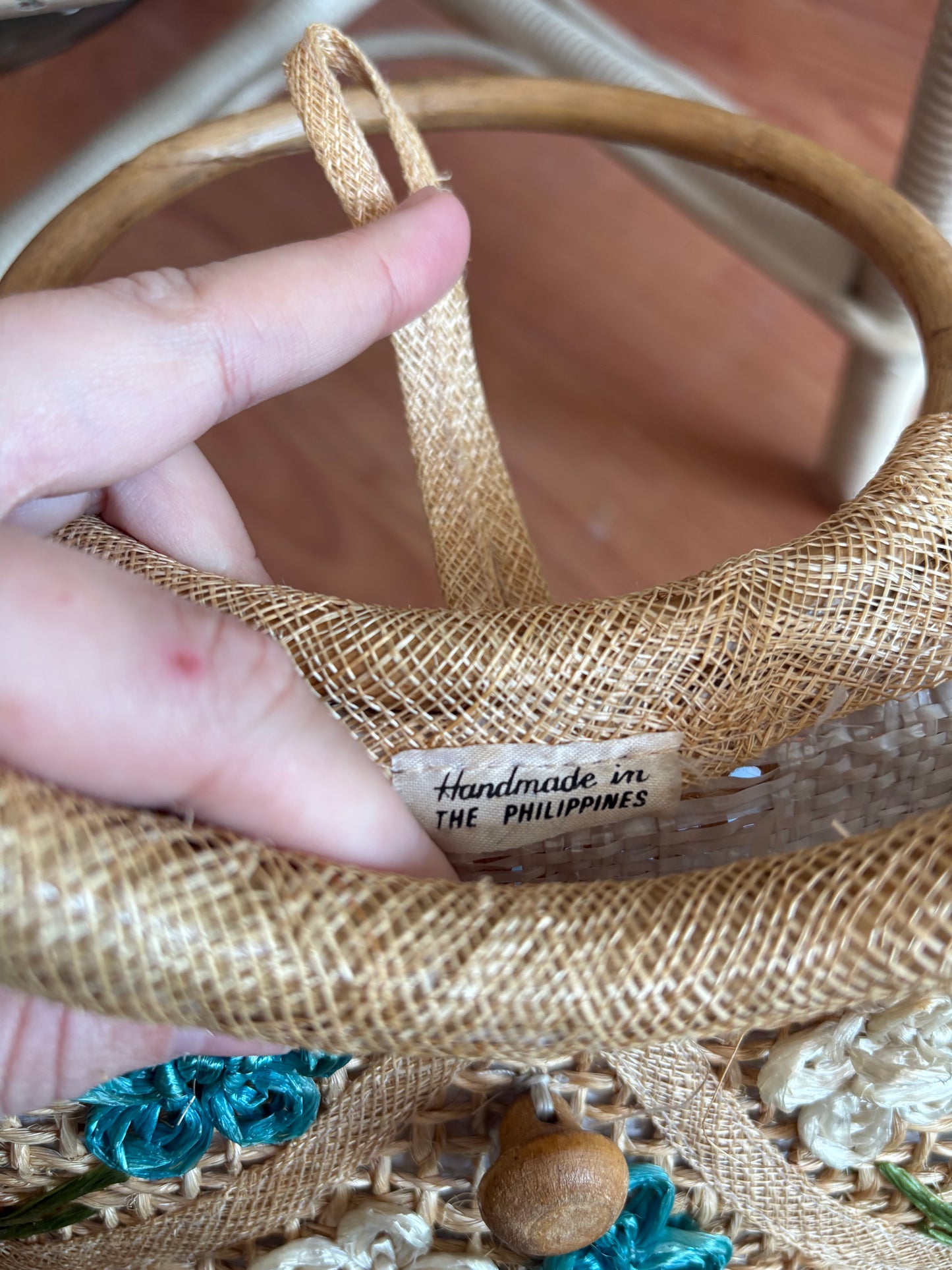 Small woven handbag with bamboo handles