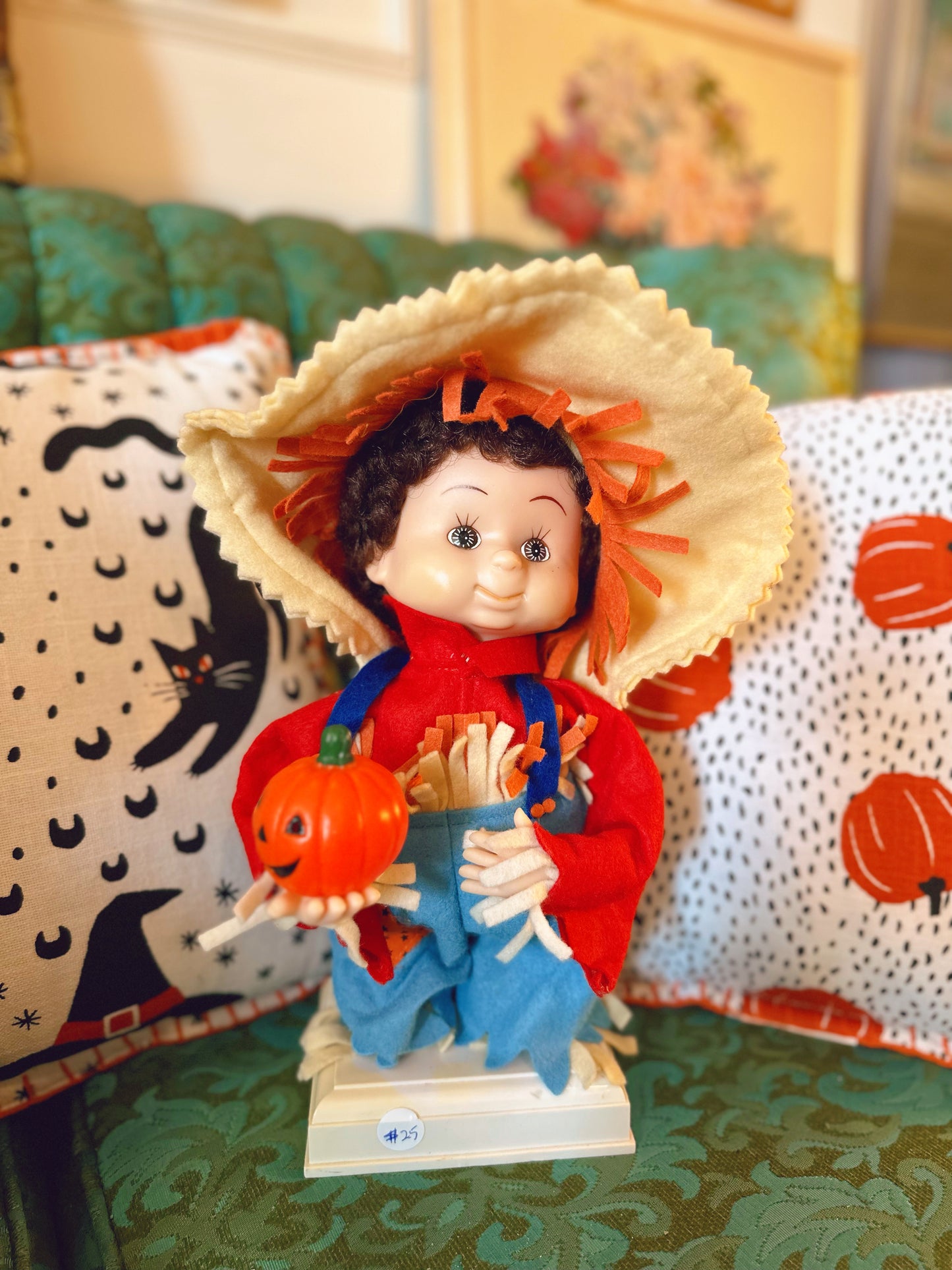 Scarecrow doll (little pumpkin lights up and he moves)