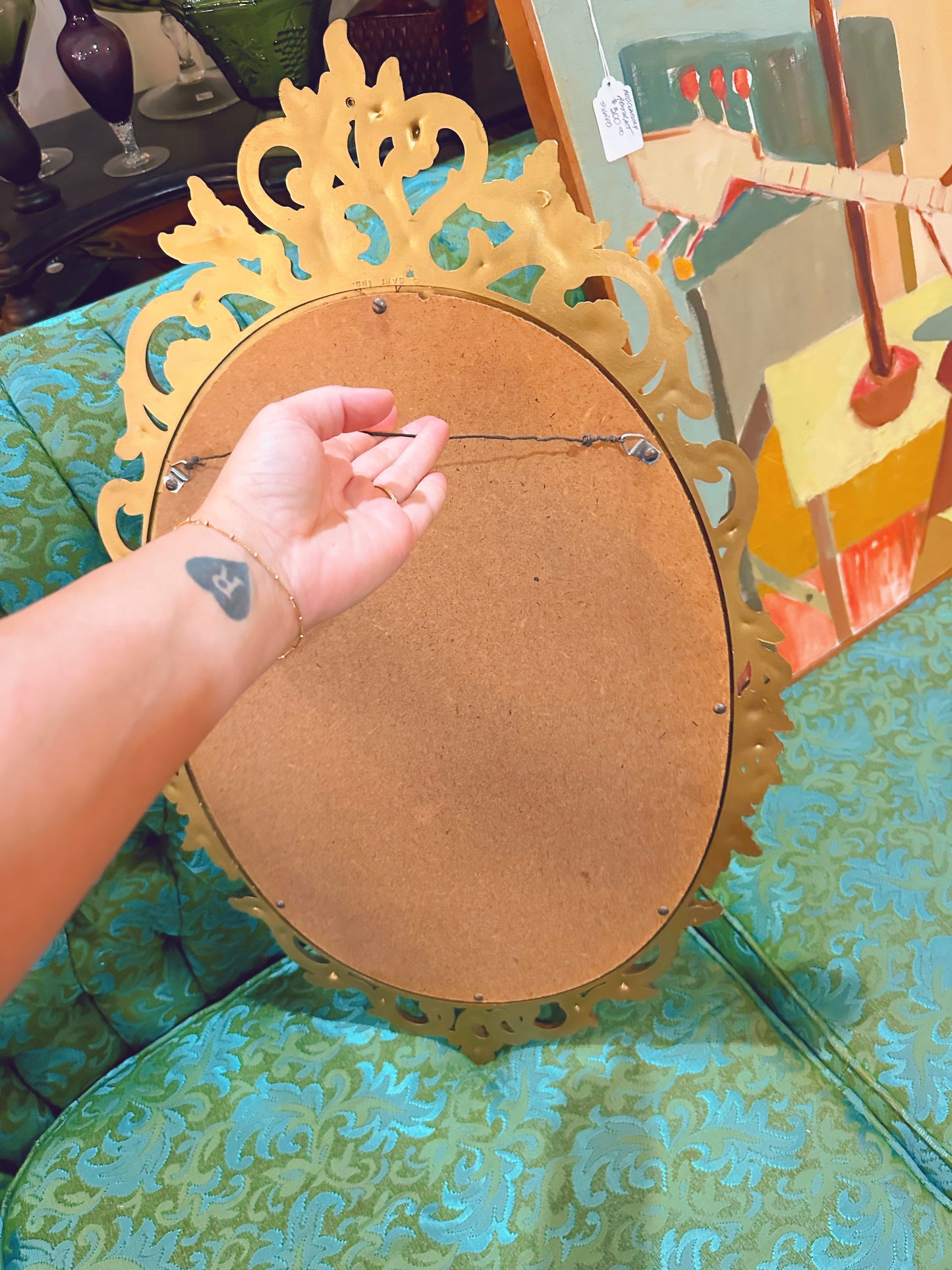 Gold Oval framed mirror