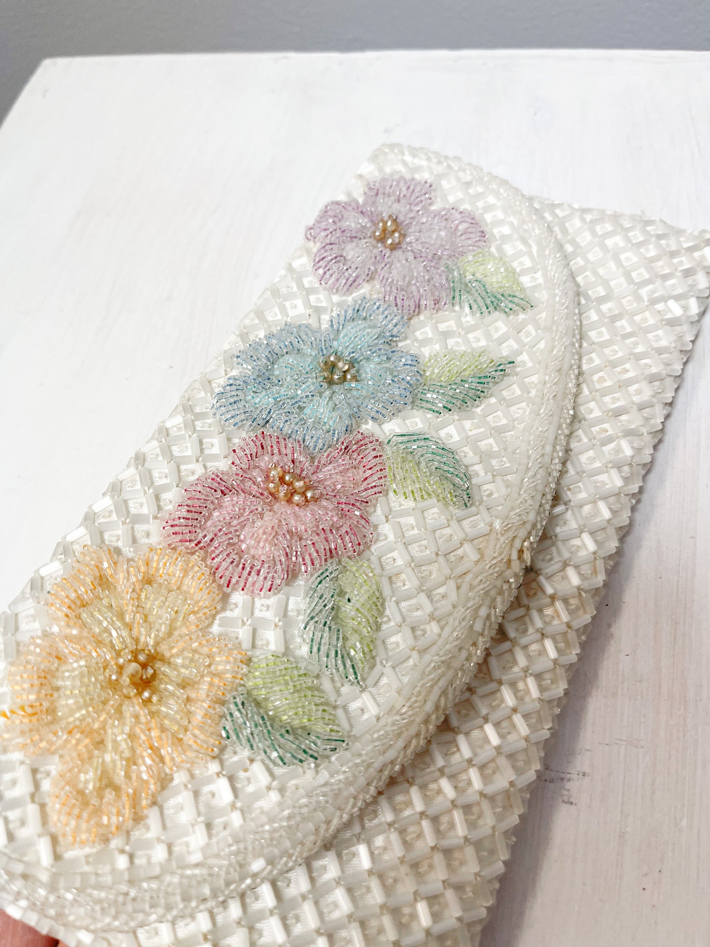 White beaded clutch with flowers