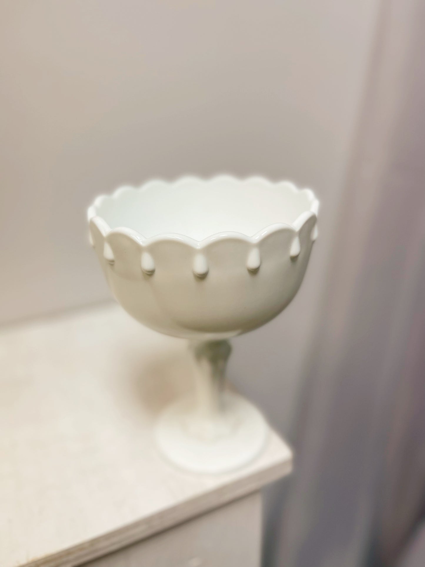 Milk glass pedestal bowl with tear drop detail