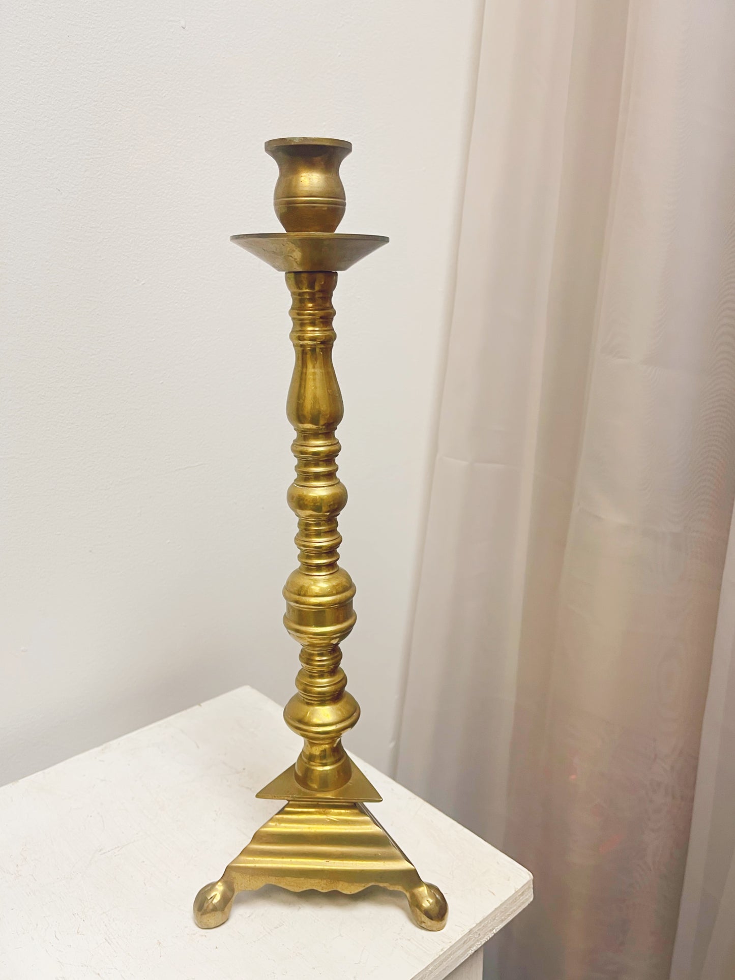 Tall brass candlestick