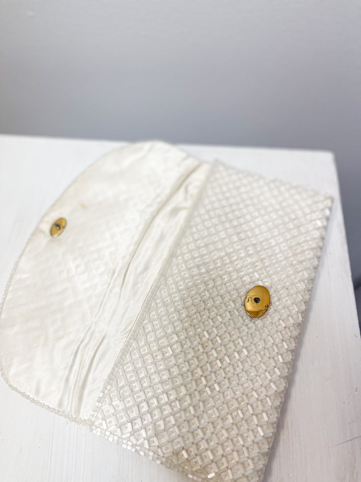 White beaded clutch with flowers