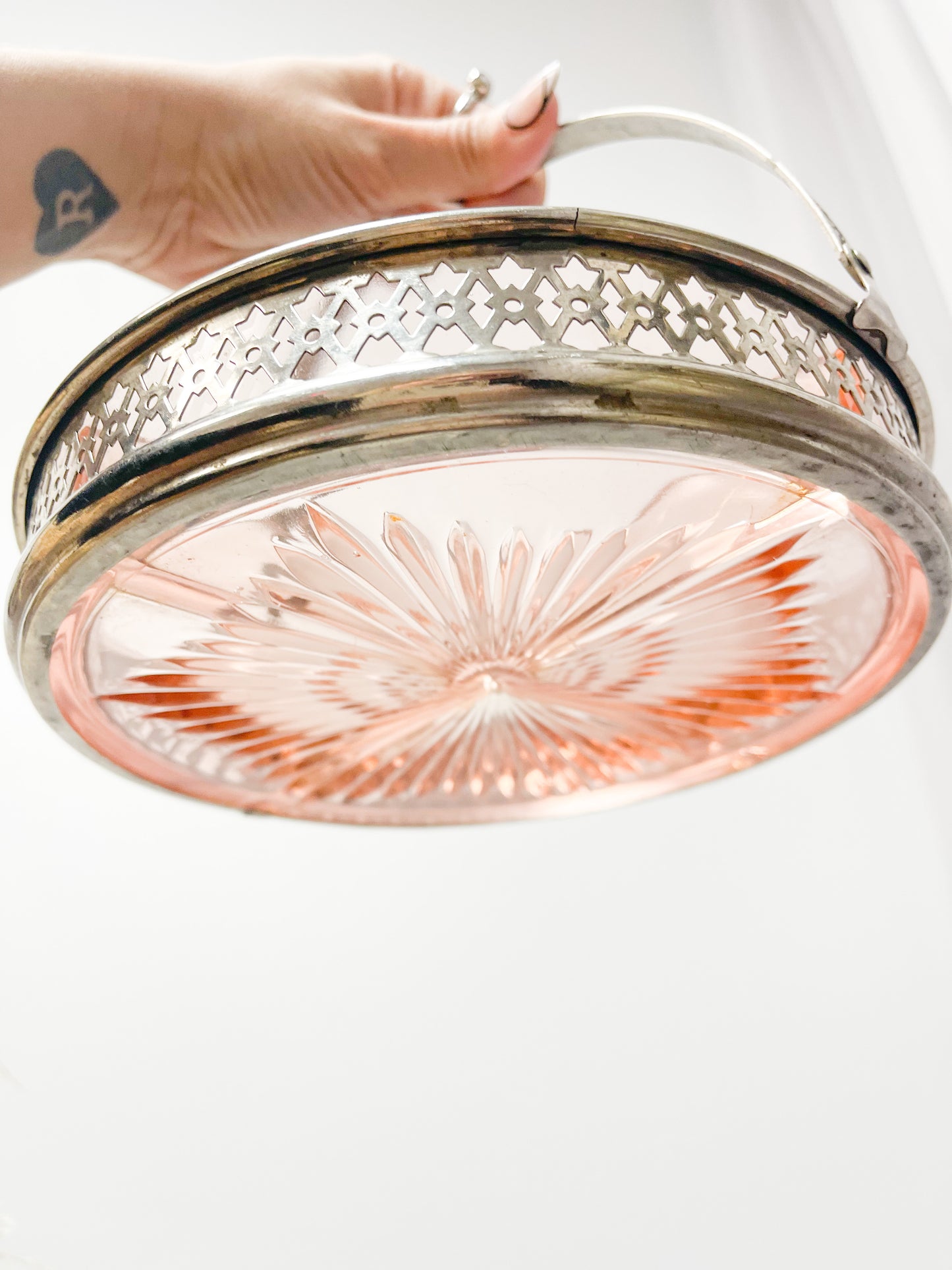 Pink glass dish with metal holder