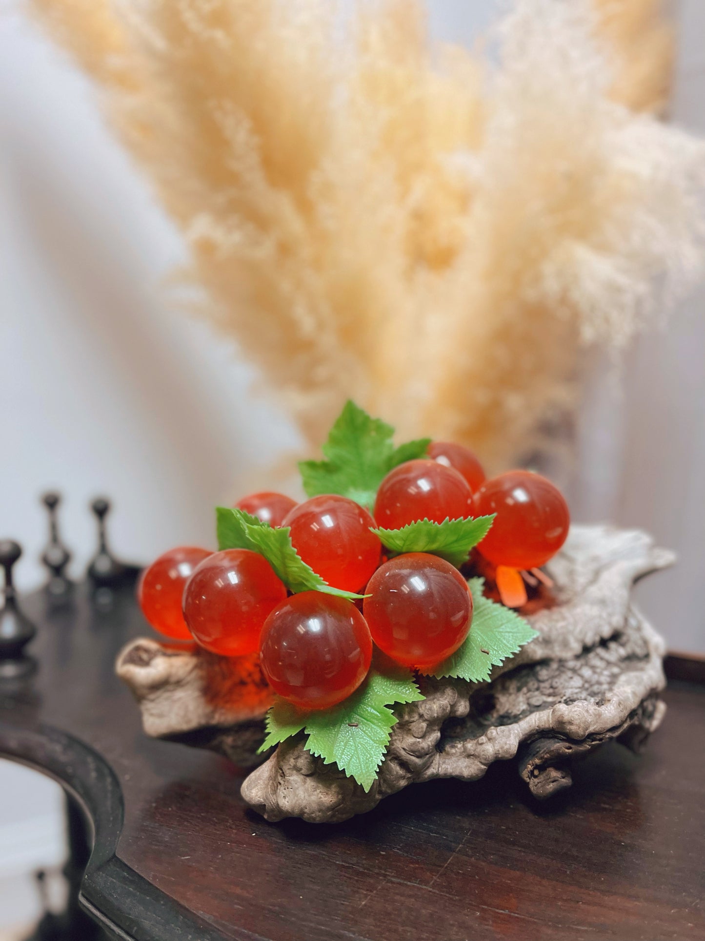 1960s red glass grape cluster on wood