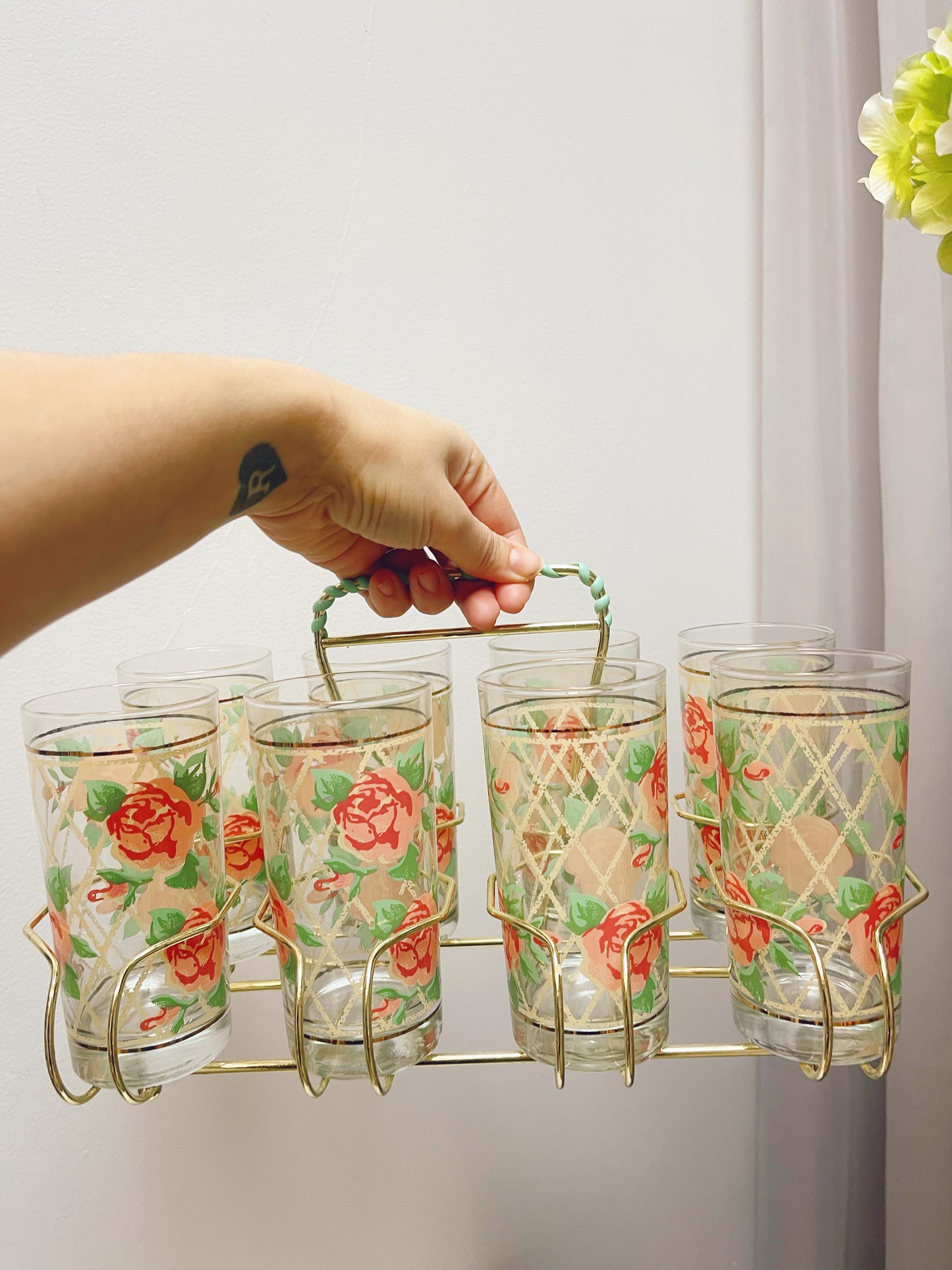 8 Rose pattern glasses in metal caddy