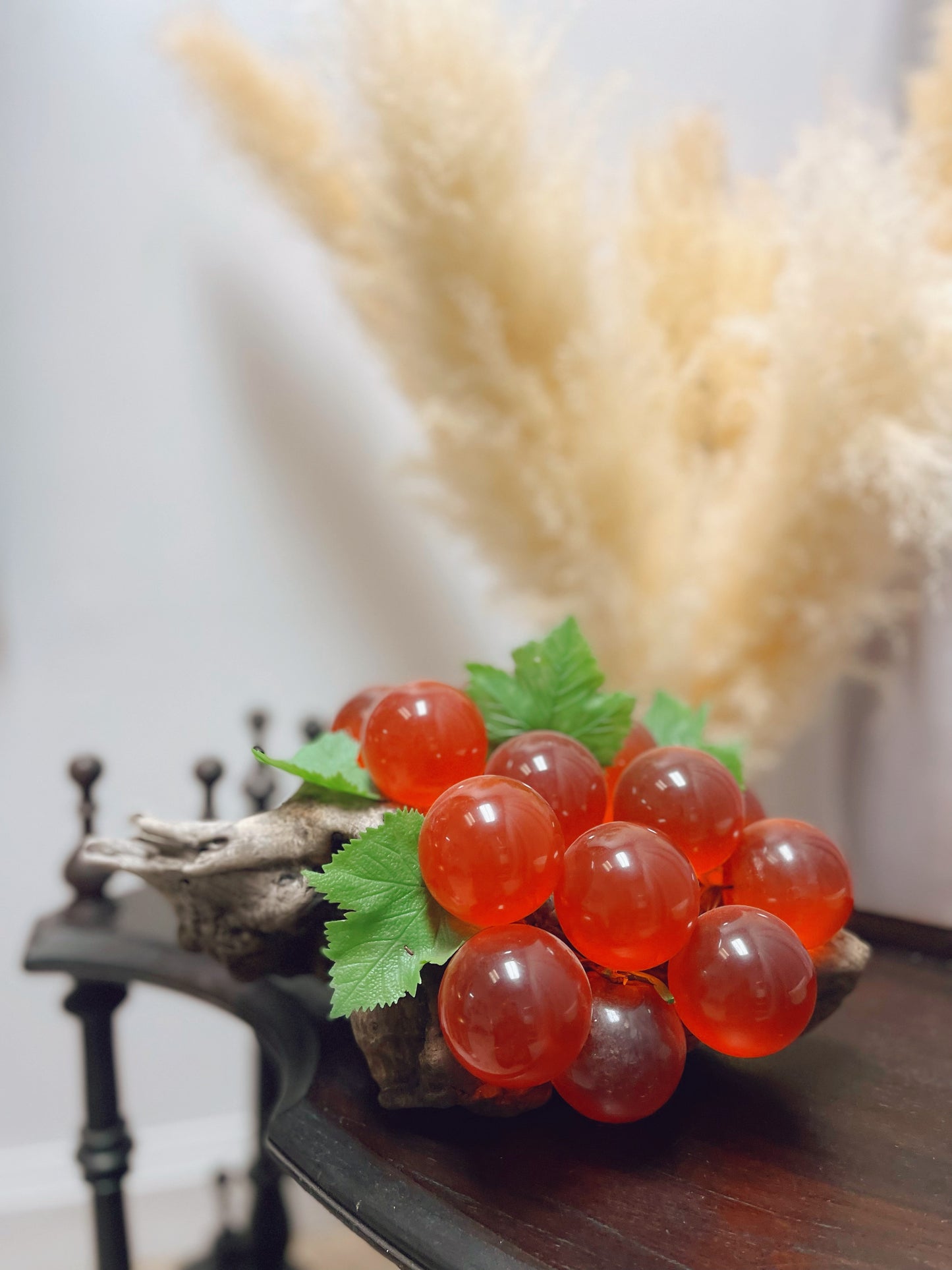 1960s red glass grape cluster on wood