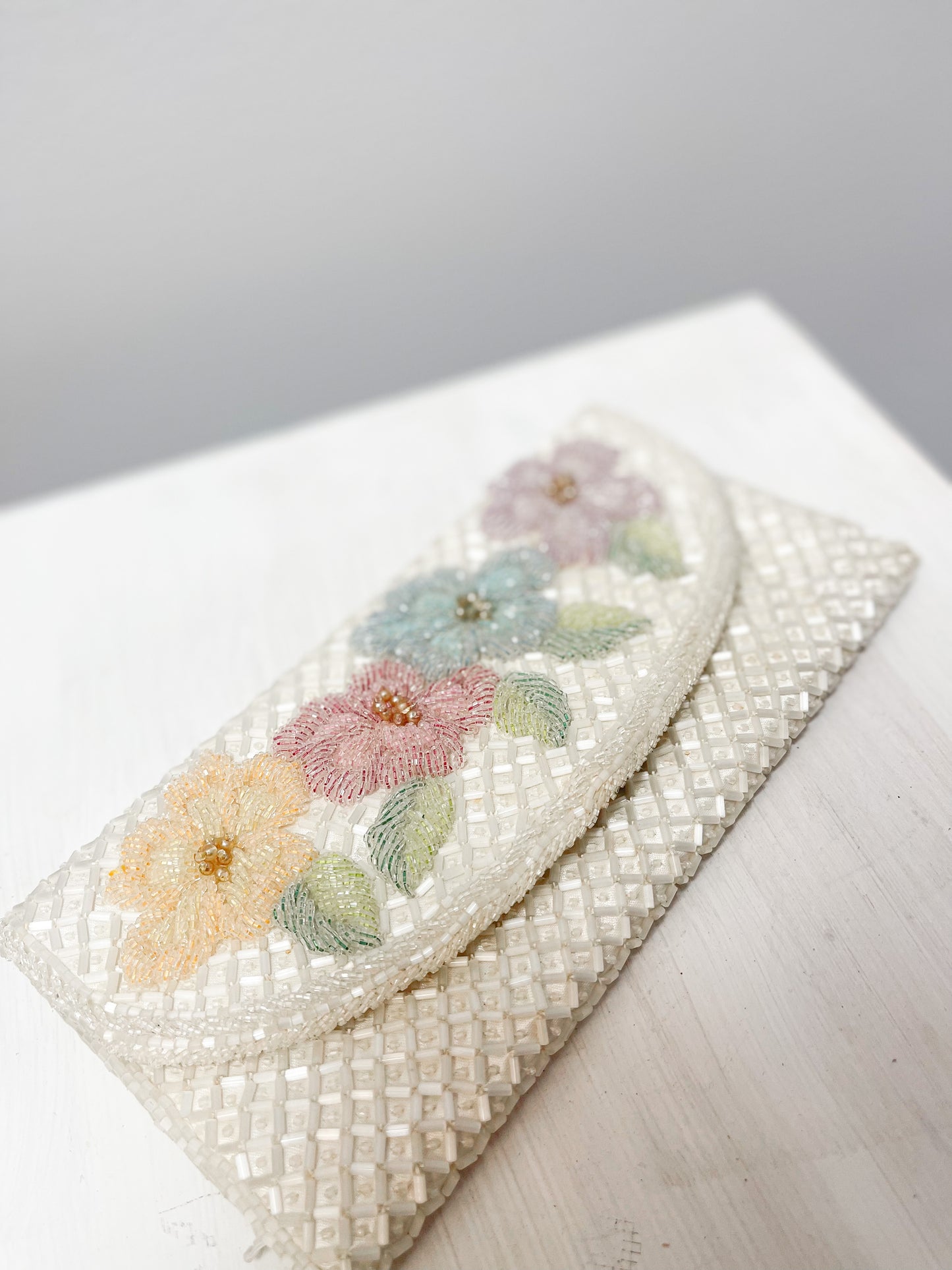 White beaded clutch with flowers